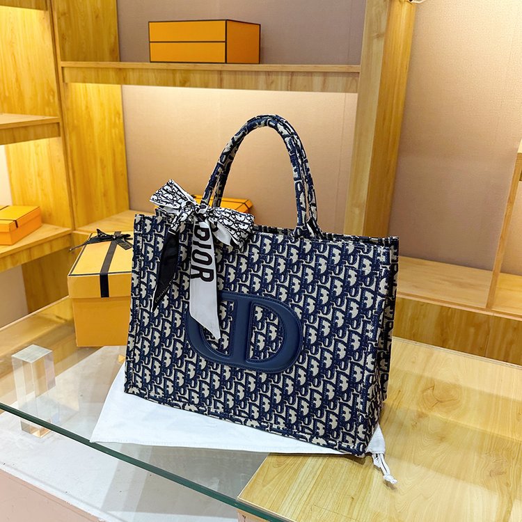 Bolsa grande para mujeres 2025 nueva moda red lienzo rojo de moda bolsa de hombro brazo universal de gran capacidad bolso de mano