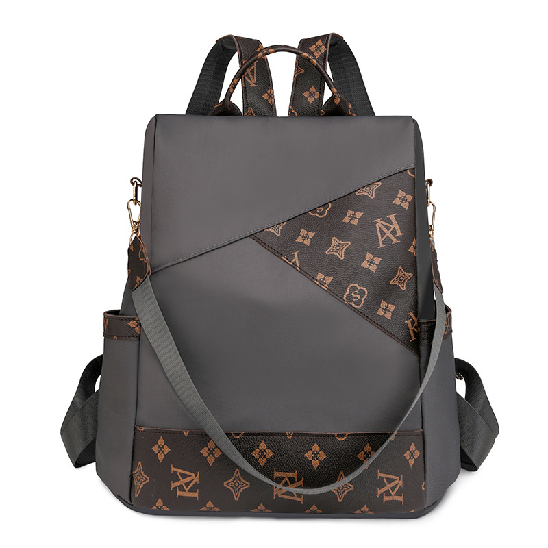 Comercio exterior al por mayor 2024 nueva mochila antirrobo de nailon para mujer retro, mochila multifuncional de doble uso de color de contraste de moda