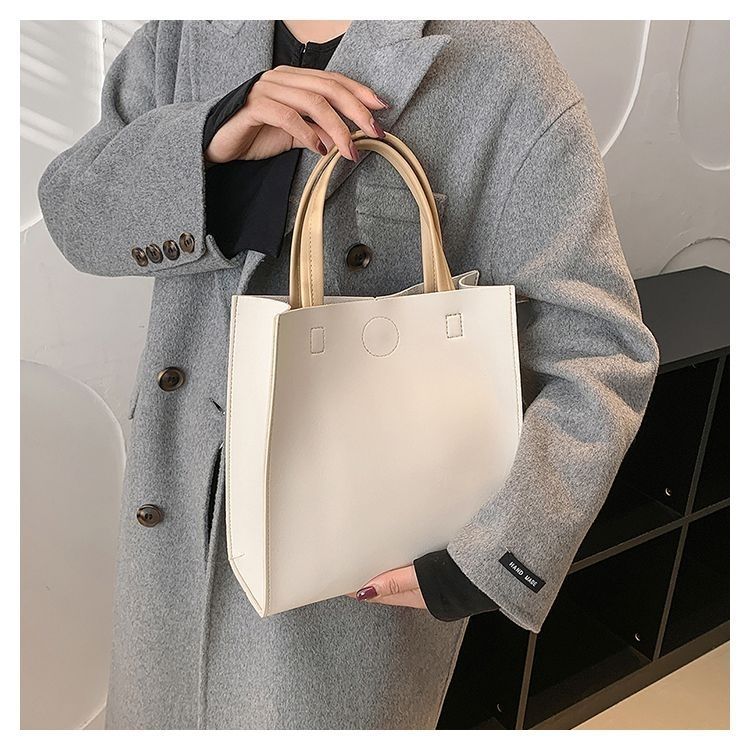 2024 New Bags Korean Version Versatile Commuting Bags Large Capacity Portable Tote Bag Temperament Popular Women’s Bag Vertical Style_voghion.com