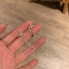 Серебристый, нерегулярный крест/звезда с кисточкой