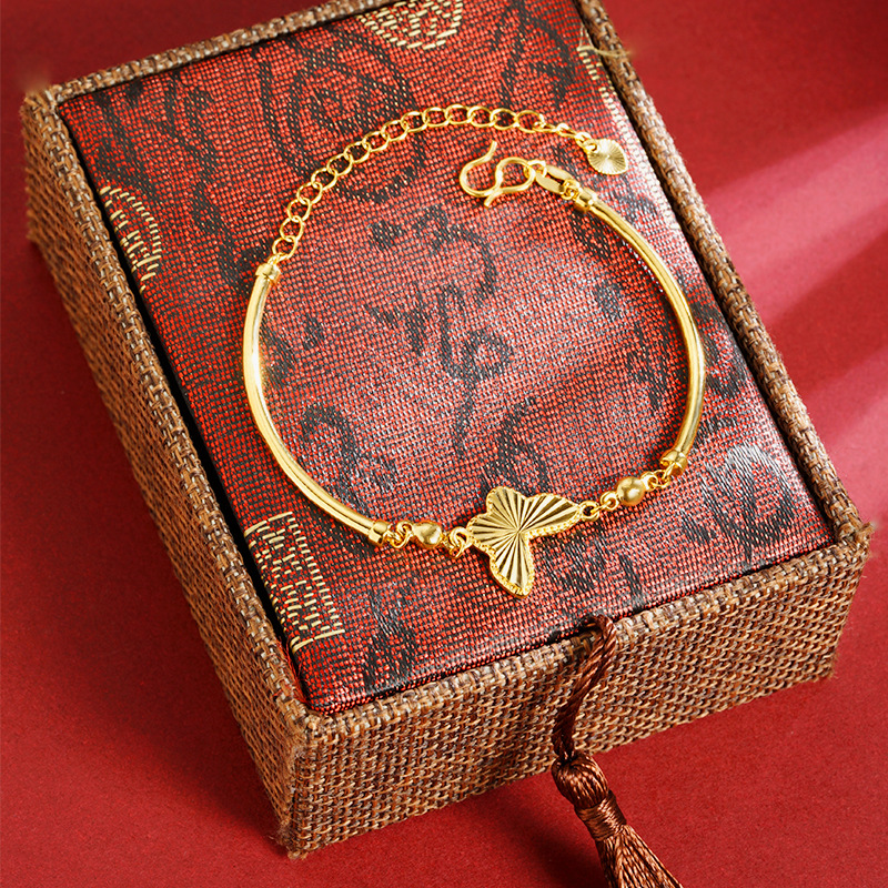Simples y lujosos viento de oro de arena vietnamita mariposa pulsera de tubo de cobre de alta feminidad joyas de aleación de cobre en línea