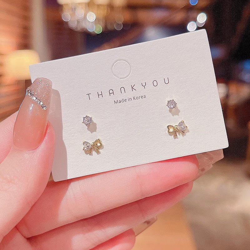 S925 aguja de plata exquisito ZIRCON oído-aumento traje pequeño oído espárragos Luz de lujo nicho versátil temperamento perla pendientes femeninos