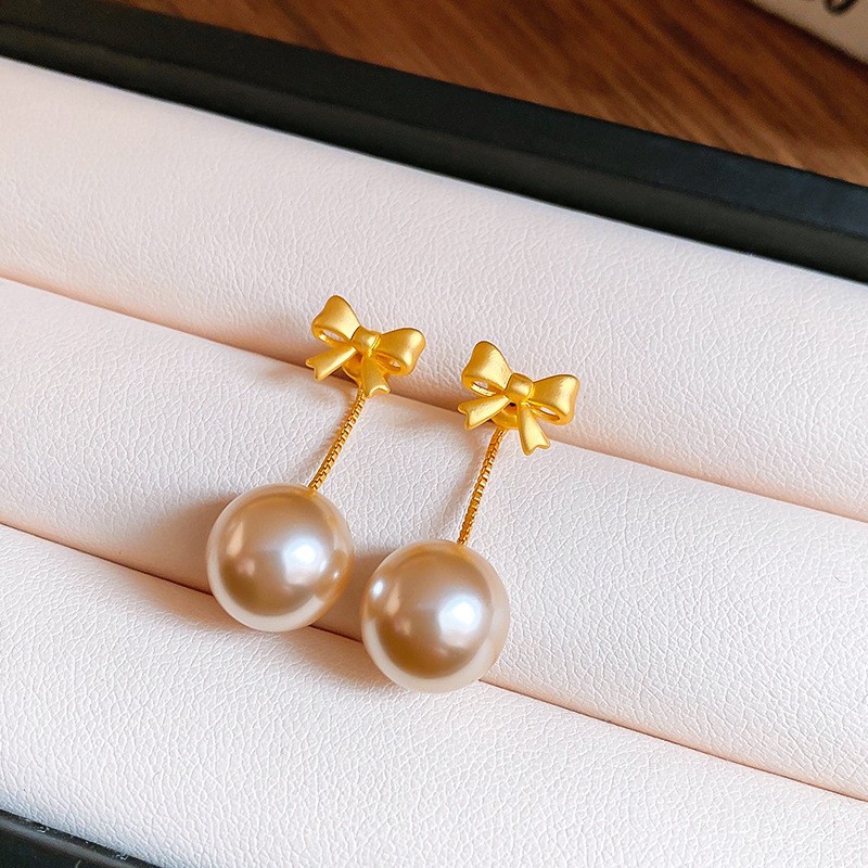 Aguja de plata Pendientes de lazo de diamantes coreanos Pendientes de temperamento de moda de todo fósforo Pendientes de diseño de nicho Sentido de lujo ligero