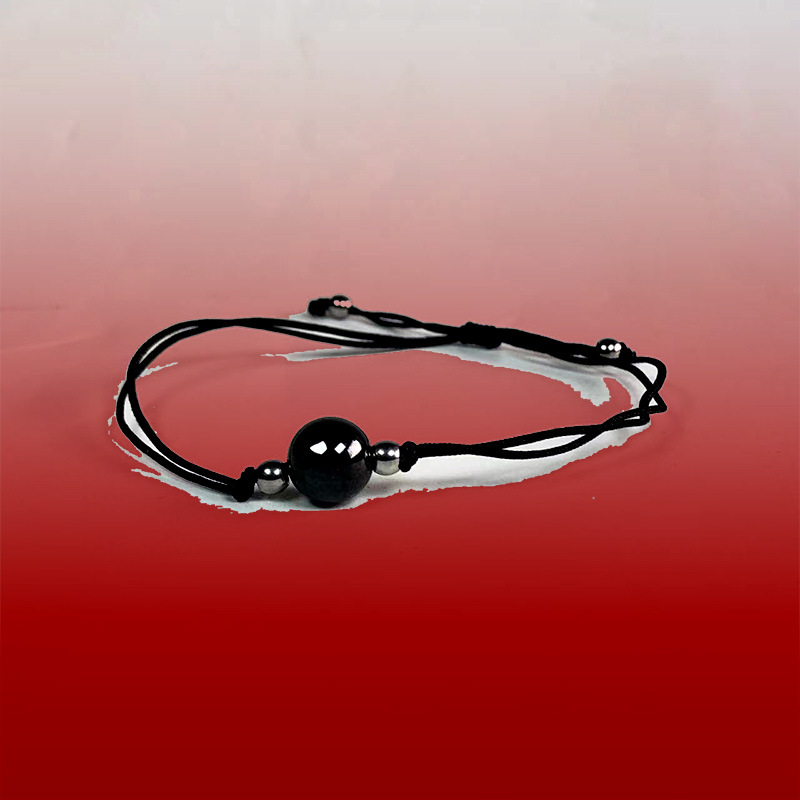 Yiwu pequeña joyería al por mayor blanco y negro de cerámica Rosario pareja animal año ronda cuentas cuerda de mano puesto de suministro al por mayor