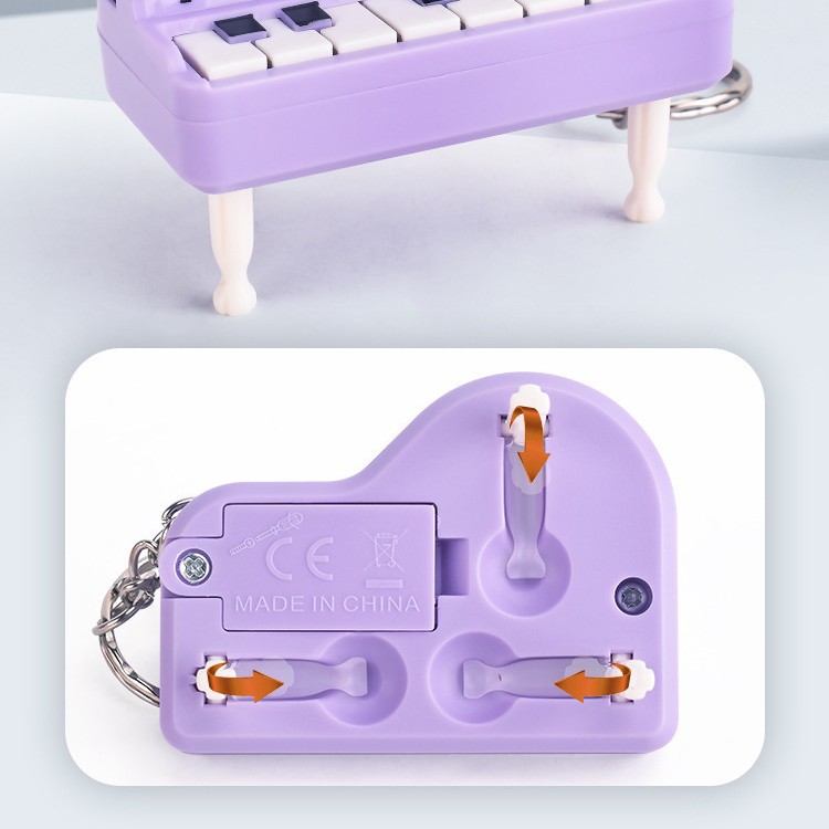 Transfronterizo portátil mini plegable piano de escritorio llavero colgante de simulación de teclas luminosas regalos musicales creativos
