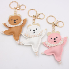 A cute and adorable leather keychain accessory with a ballet dancing bear, perfect for girls, suitable for decorating handbags and backpacks.