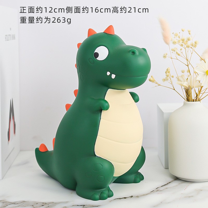 La decoración del hogar de la alcancía de los niños lindos de dibujos animados transfronterizos puede entrar y salir de la alcancía de dinosaurio resistente a la caída