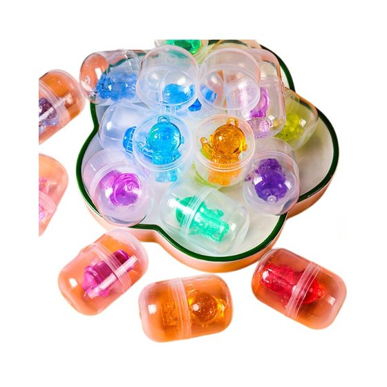 Factory wholesale 32*47mm capsule twist egg toy 2 yuan twist egg ball color crystal twist egg blind box gift
