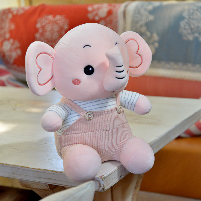 Caricatura muñeca elefante muñeca muñeca de peluche muñeca elefante muñeca niños calmar muñeca almohada en la cama
