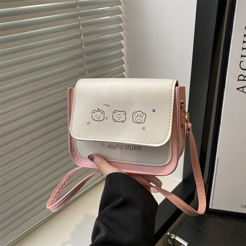 Bolso de mujer de color contrastante 2025 nuevo estilo de estilo de impresión de moda extranjera, bolso de hombro simple, bolso de mochila dulce