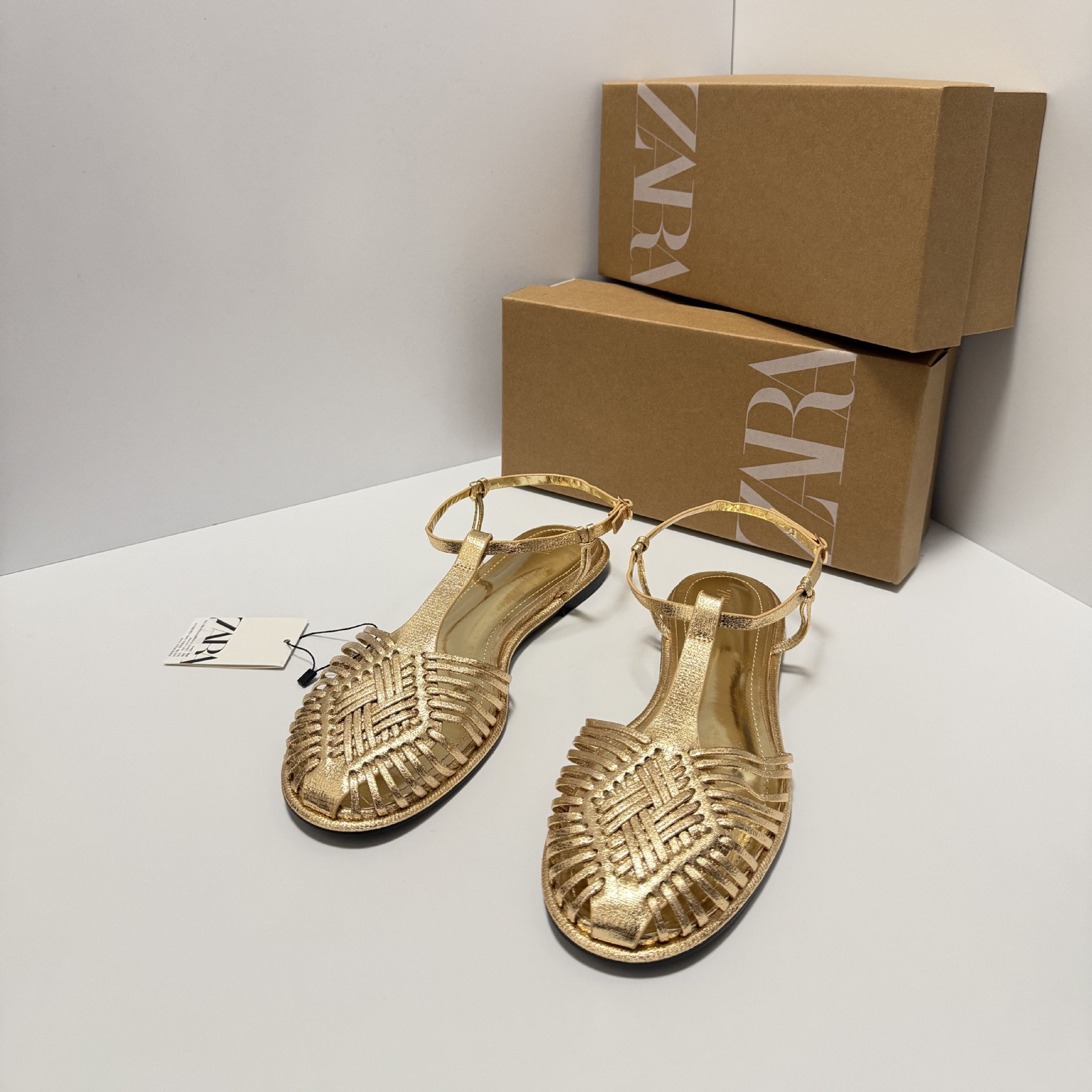 ZA2026 nuevo retro cabeza redonda plana zapatos romanos tejidos huecos hebilla de moda sandalias de cabeza