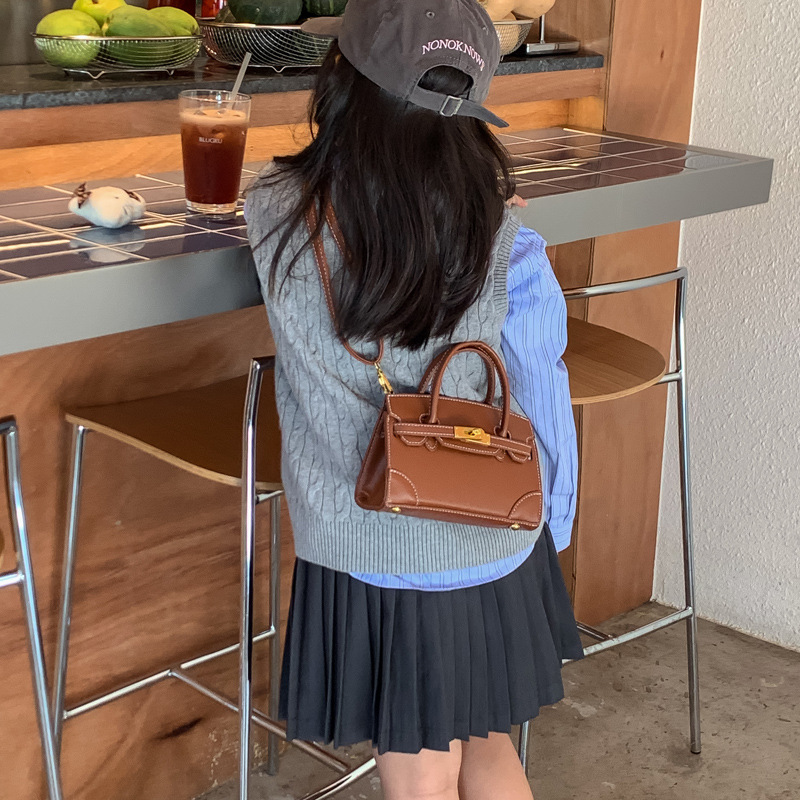 Coreano simple color sólido bolso de hombro para niños y niñas pequeño mini bolso de mano bebé nuevo bolso de comercio exterior transfronterizo para niños