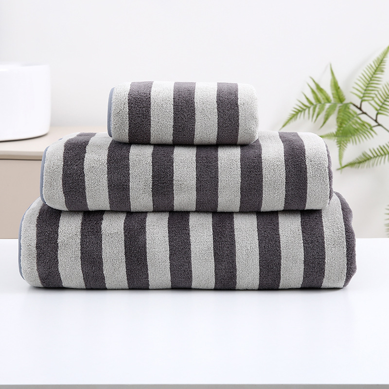 Toallas anchas al por mayor engrosadas absorción suave envueltas cuerpo grande toalla de baño de urdimbre simple toalla de baño de lana de coral