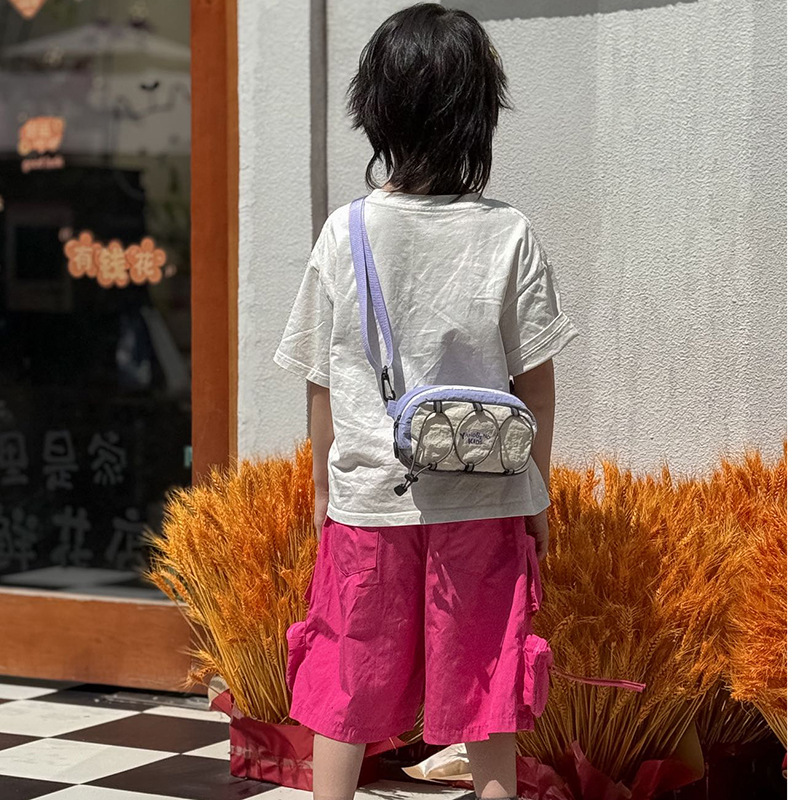 2026 versión coreana de la cuerda extranjera, bolsas de hombro para hombres y mujeres, bolsas de hombro ligeras y compactas, bolsas de hombro de color, nuevas bolsas de niños transfronterizas