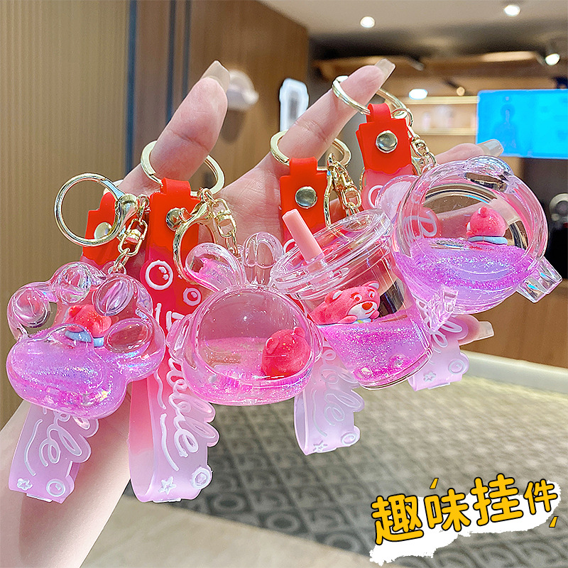 Botella de arena flotante de aceite flash fresas oso muñeca colgante llavero mochila para hombres y mujeres colgantes de automóviles pequeños regalos al por mayor