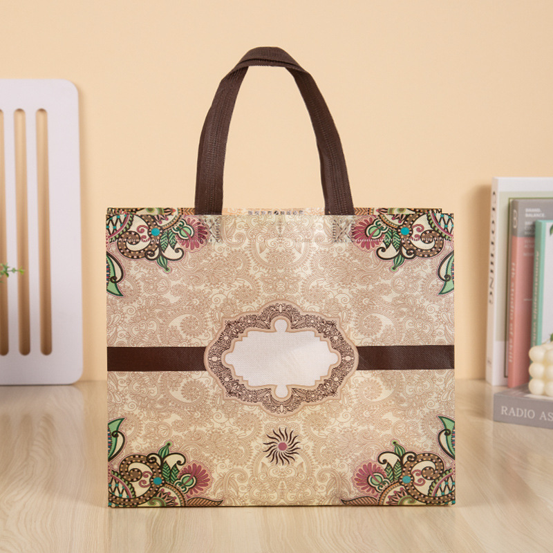 Bolso no tejido al por mayor de la ropa revestida bolso de compras de las mujeres impreso LOGOTIPO bolsa de regalo bolso no tejido bolso de mano