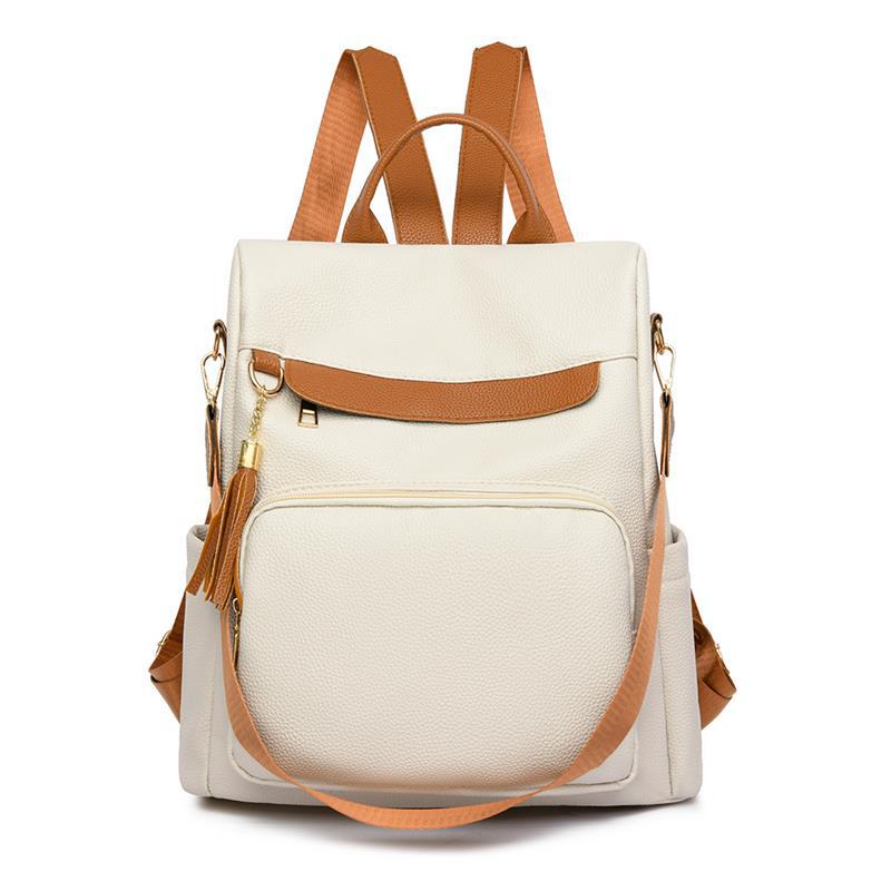 2024 nuevas damas casuales de cuero suave mochila antirrobo moda borla color de contraste mochila de viaje de gran capacidad al por mayor