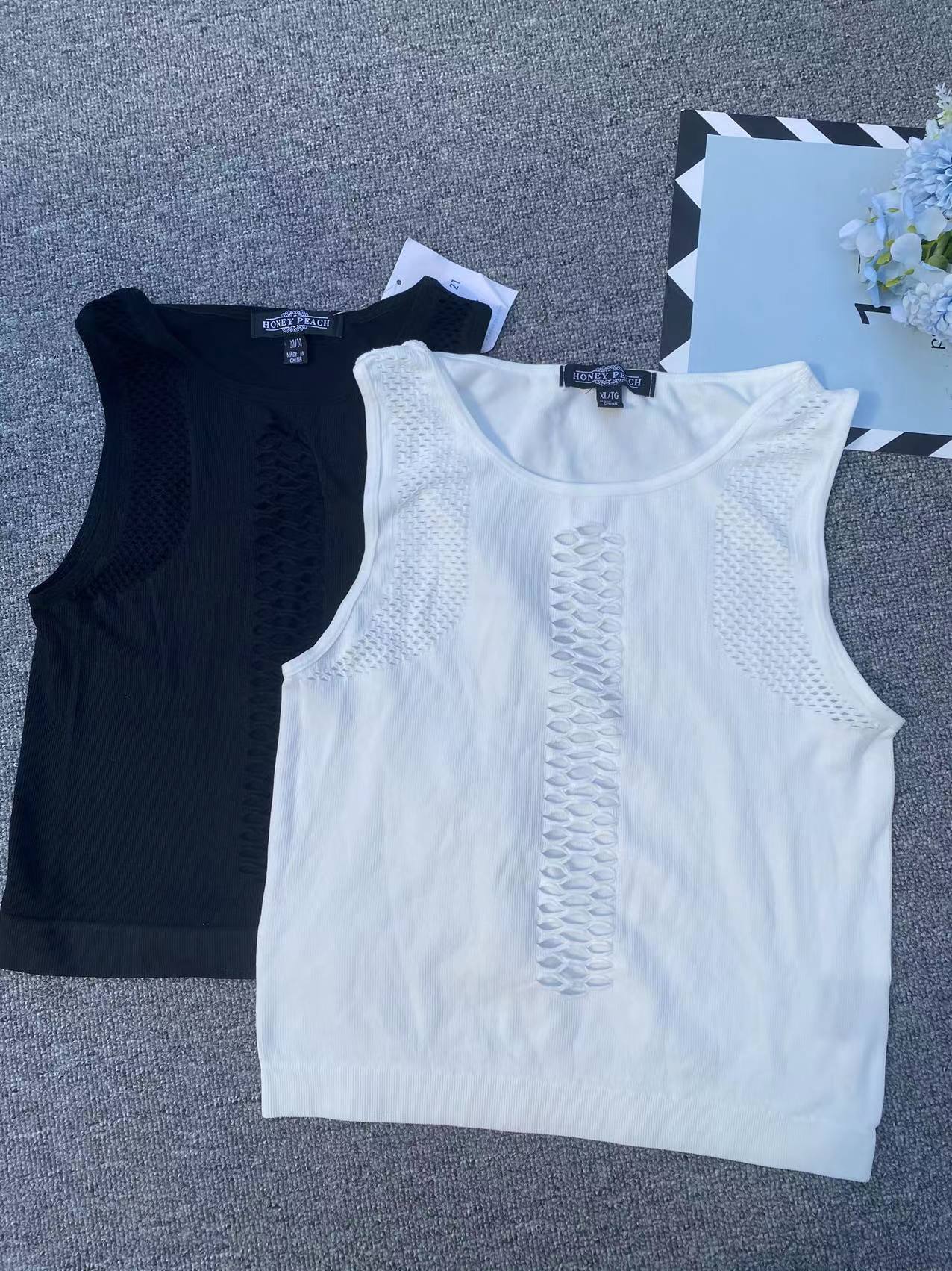 Exportación Nueva sin costuras de manga corta hueco de gran tamaño elástico cómodo prendas de vestir exteriores superior al por mayor