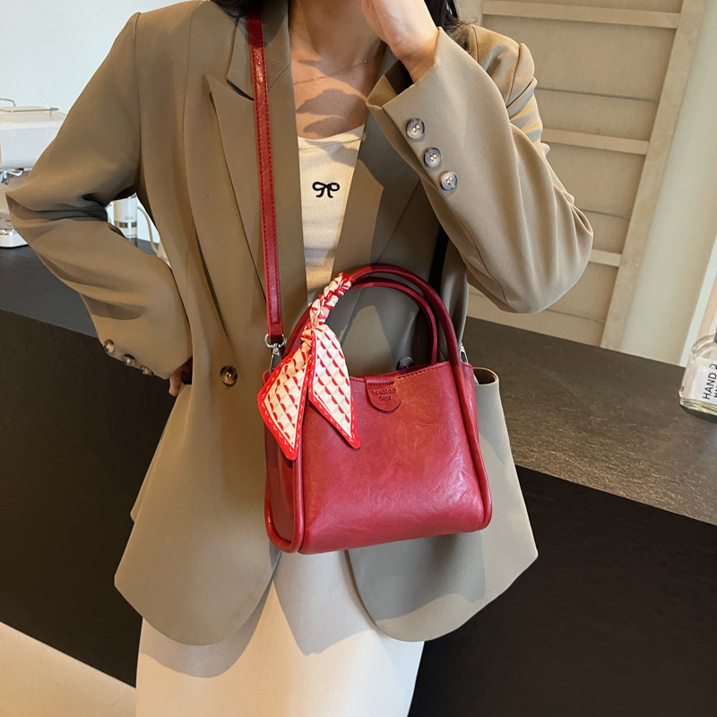 Cestas de verduras portátiles de moda simple 2024 nueva bolsa de mujer estilo extranjero versátil bolso de cubo de alta calidad nicho mochila