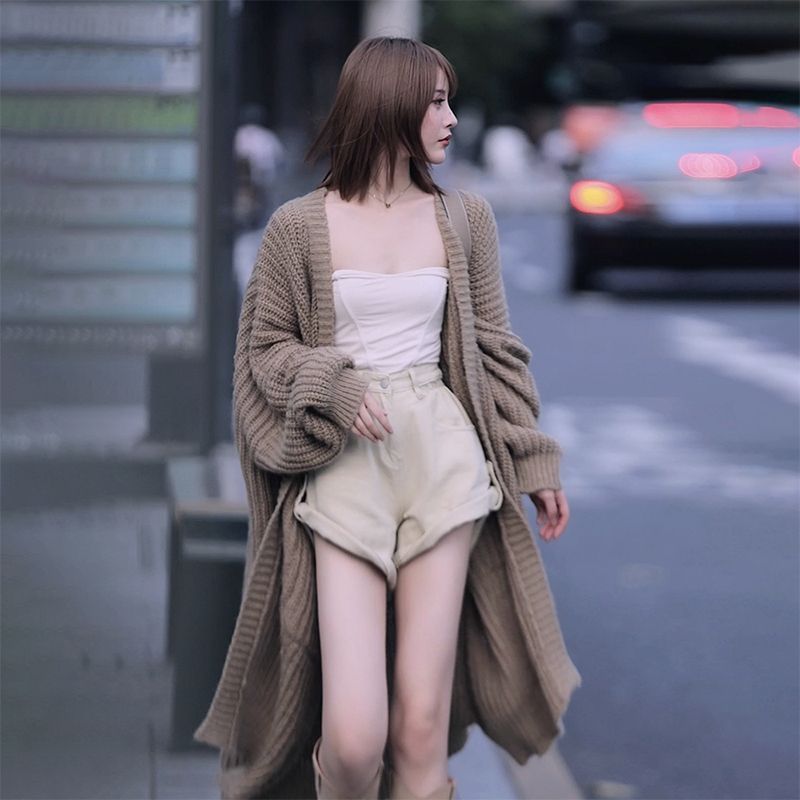 秋冬の怠惰な風潮の中で長いタイプの膝のセーターのコートの女性のゆったりしている百合は底の長袖のニットのカーディガンの厚い女性を打ちます。|undefined