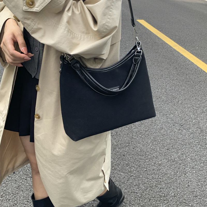 Bolsos de hombro de alta textura para mujeres 2025, otoño y invierno, nuevo tipo de bolso de cubo de hombro coreano, moda de mochila de viaje.