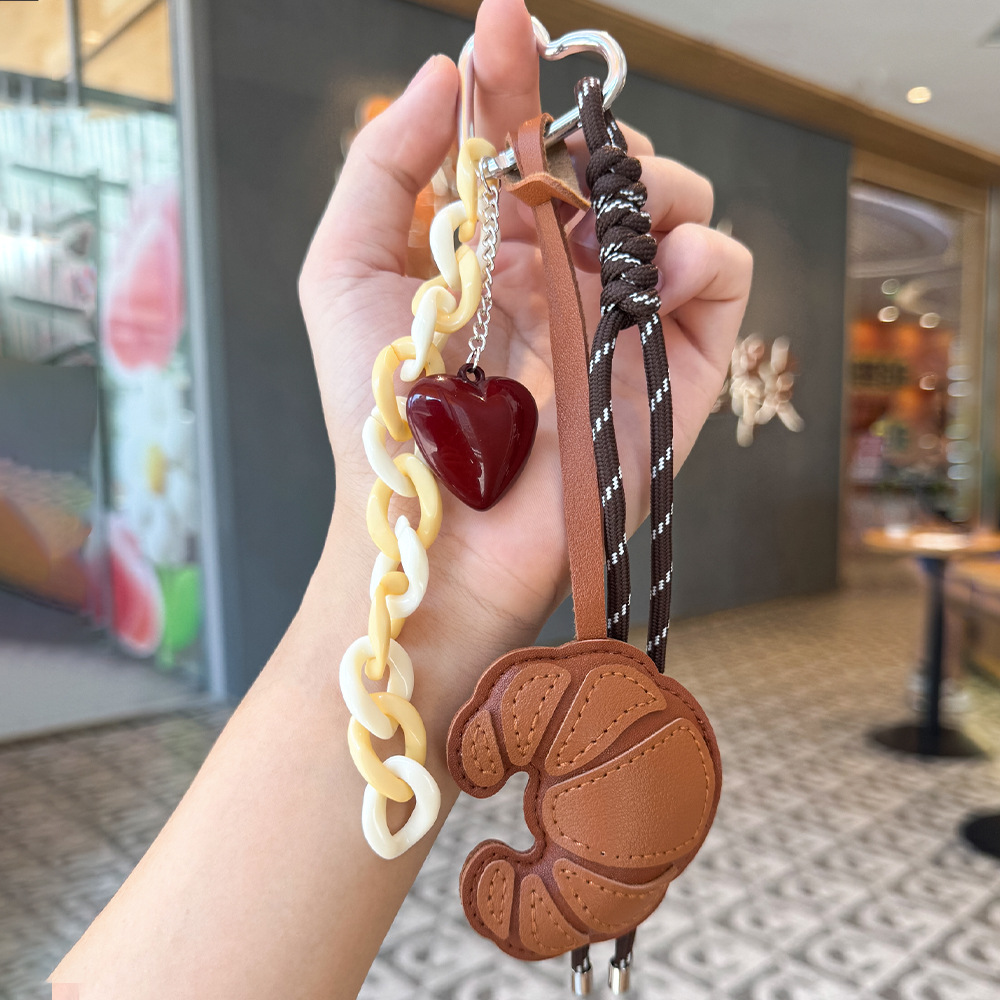 Nuevos productos transfronterizos creativos de letras de color cuerdas trenzadas llavero amor dibujos animados accesorios de diseño bolsos colgantes
