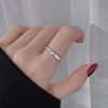 Small design ring, jewelry, silver 925 sample, on index finger, light luxury style