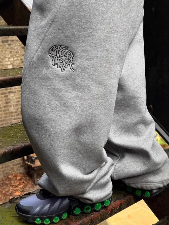 Europa y Estados Unidos transfronterizos americanos retro versátil suelto hip-hop empalme bordado pantalones de hombre comercio exterior