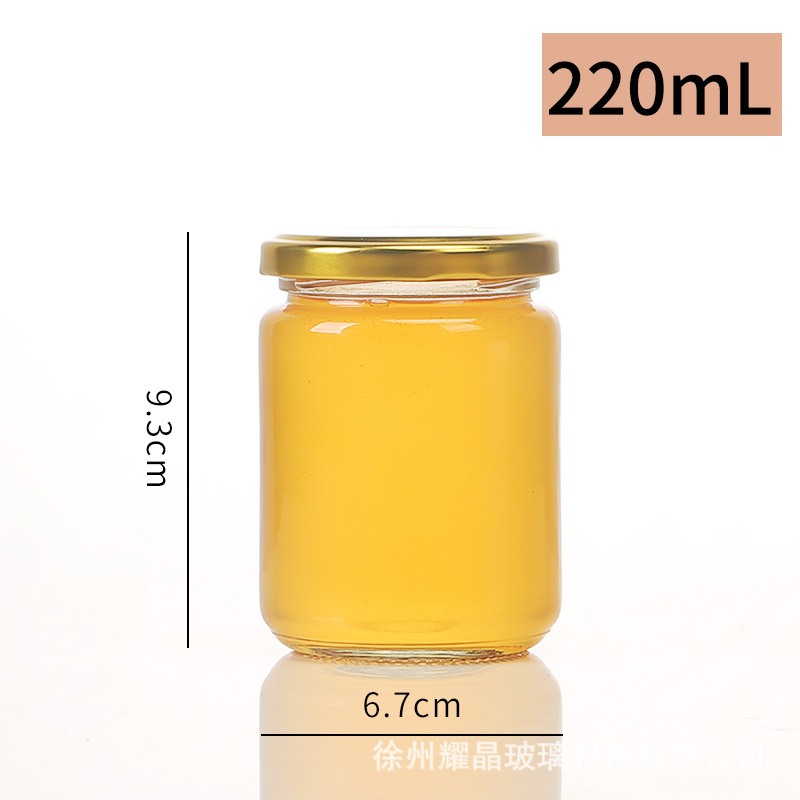Botella de vidrio redonda de grado alimenticio, botella enlatada transparente sellada, botella de salsa de chile vacía, botella de miel con tapa para cocinar