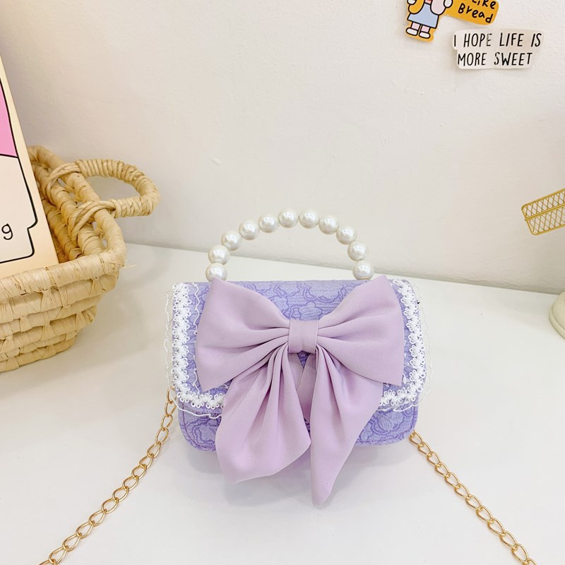 Otoño y invierno coreano arco camellia bolsas de niños de encaje de mano perlas bolsas mochilas para niñas de jardín de infantes
