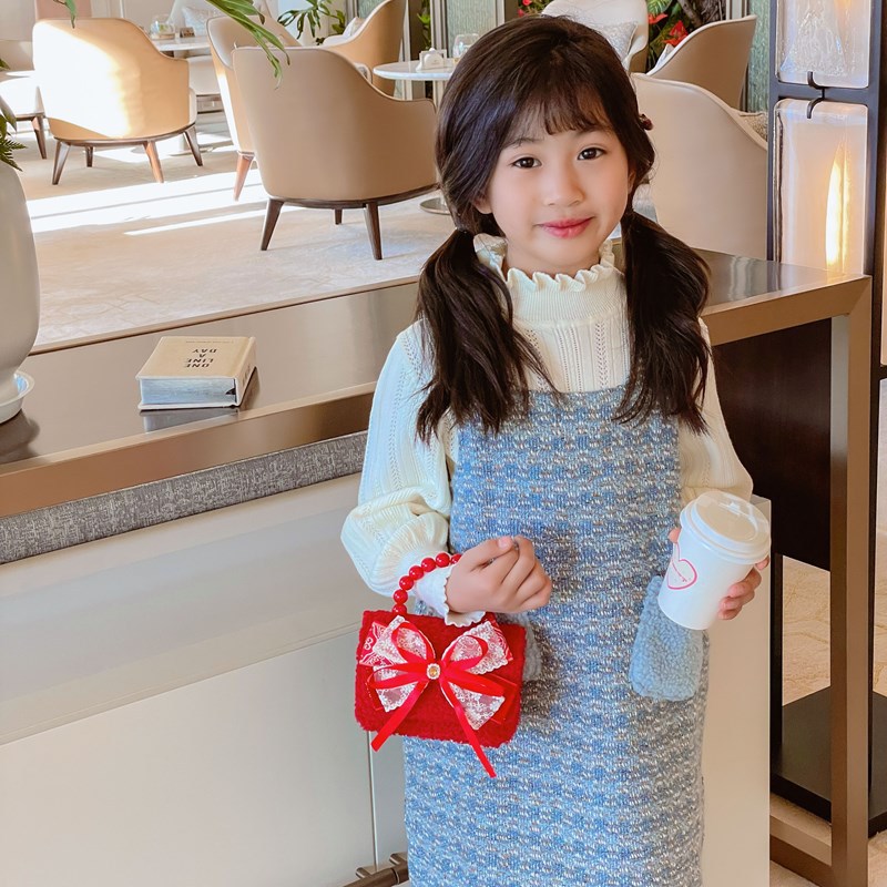 Bolsa de hombro de niña roja de Año Nuevo lindo arco borracha bolsa de bebé 2025 nueva cadena bolsa de niños