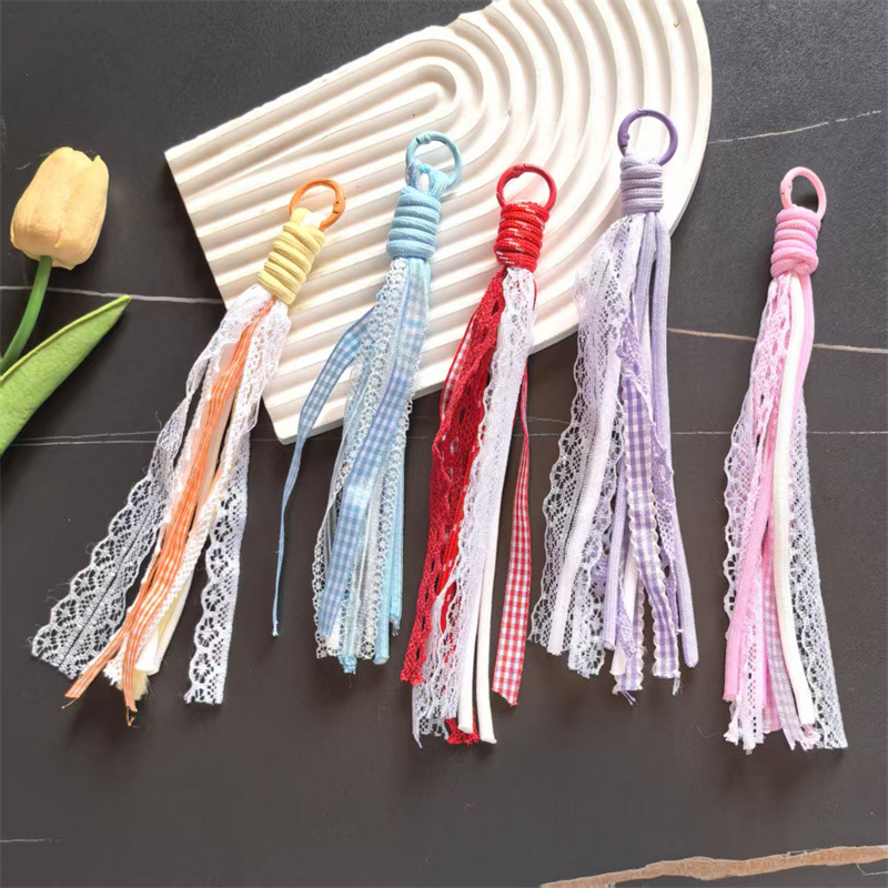 Accesorios de éxito en línea de teléfono móvil cordón de encaje de viento de dopamina accesorios bolsos llaveros colgantes al por mayor image 3