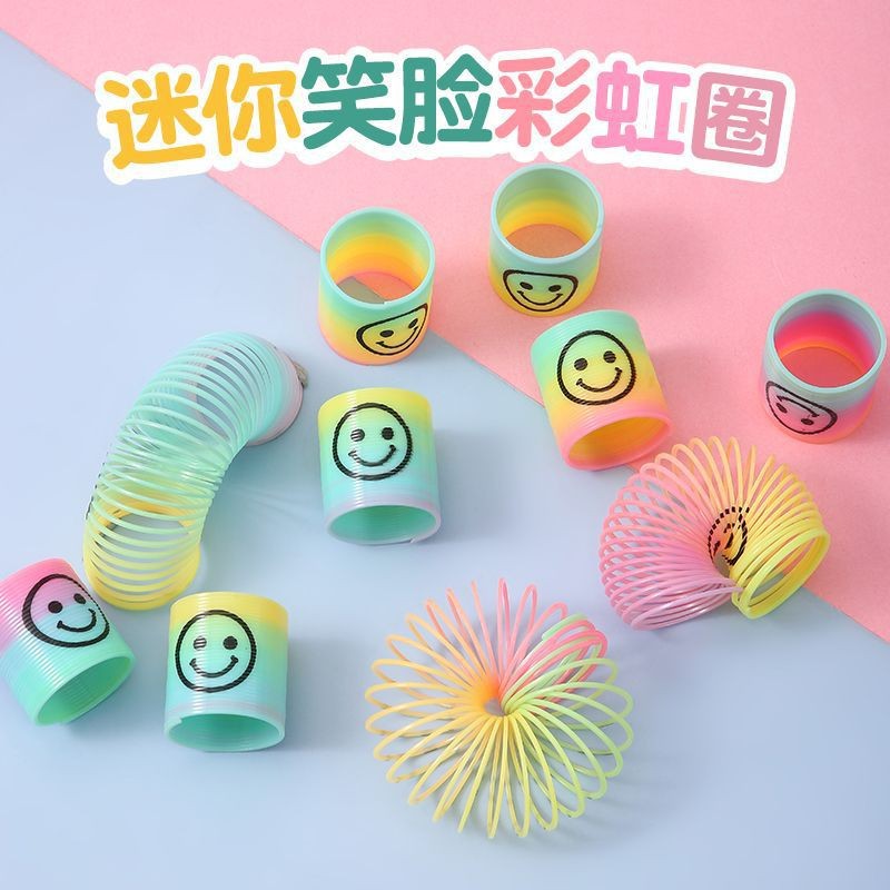 Niños multicolores bobinas mini cara sonriente arco iris anillo colorido anillo elástico estand de juguetes de premios suministro transfronterizo