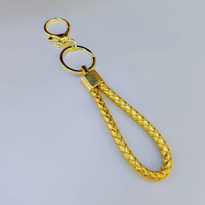 Ronda de la langosta hebilla PU cuero trenzado cuerda llavero hombres y mujeres amor llavero mano cuerda bolsa cordón fábrica directa al por mayor