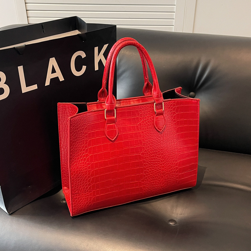 2025 primavera y verano nueva bolsa de gran capacidad temperamento simple bolso de hombro portátil mochila casual sensación de alta calidad mujer