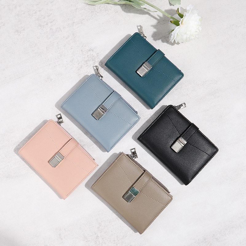 Diseño 2024 nuevo verano pequeño fresco desmagnetismo antirrobo monedero plegable bolso de tarjeta de estudiante billetera corta nicho femenino