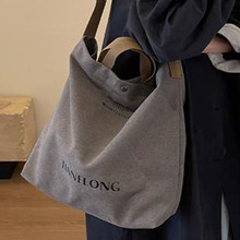 帆布包包2025新款托特包男大容量女包时尚单肩斜挎包手提通勤包