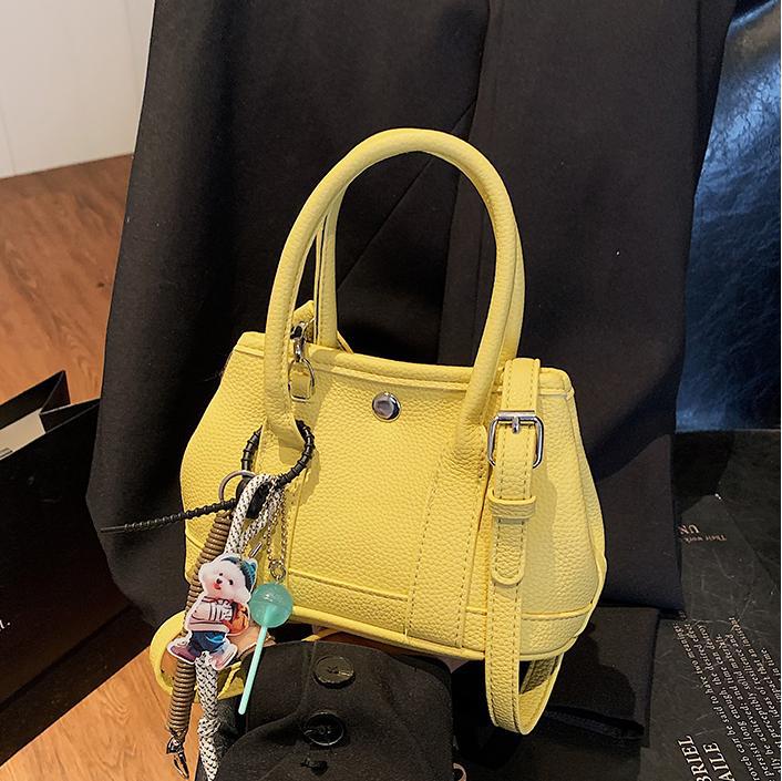 Nicho de moda explosivo bolso de cubo portátil para mujeres 2025 nuevo estilo universal simple bolso de mochila de moda extranjera bolso de mochila