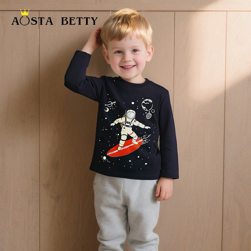 Camiseta de manga larga para niños de algodón europeo y americano otoño nueva tendenciayy astronauta planeta estampado top luminoso para niños
