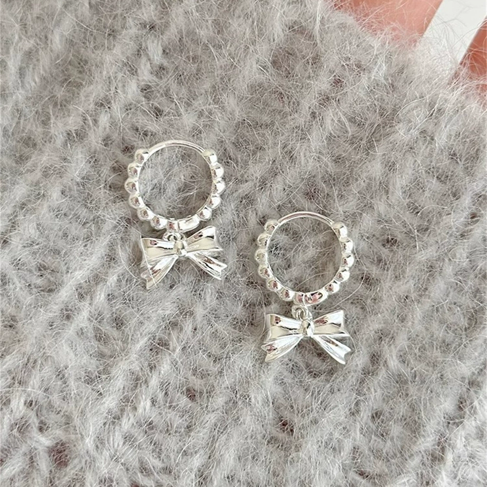 Three dimensional small design earrings with bow, 925 sample silver, light luxury style, high-quality style