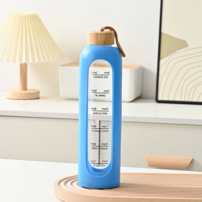 Taza de vidrio con tapa de bambú de gran capacidad transfronteriza, cuerda de elevación, cubierta de silicona portátil, taza de agua graduada, botella de agua deportiva de vidrio de alto valor