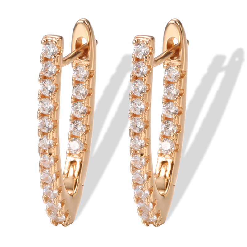 golden fashionable earrings with zircon
