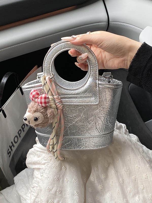Bolso para mujeres 2026 nuevo nicho coreano de comida de mano cesta bolsa de cubo de textura alta de viaje mochila de hombro