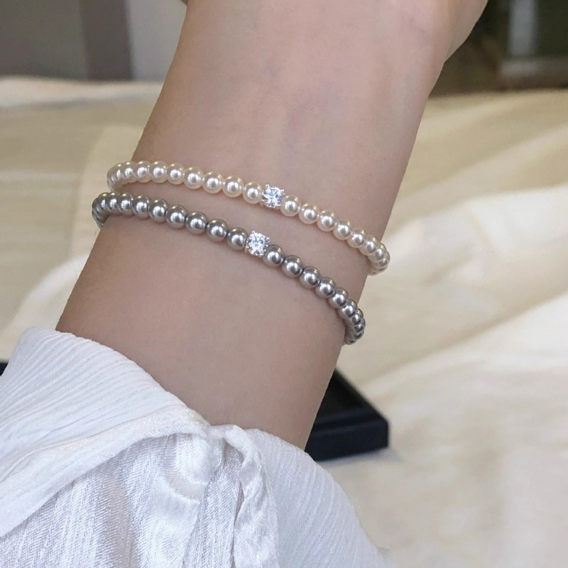s925 Shijia Pearl round simple four-claw shining square diamond French light luxury fashion elegant elastic rope bracelet