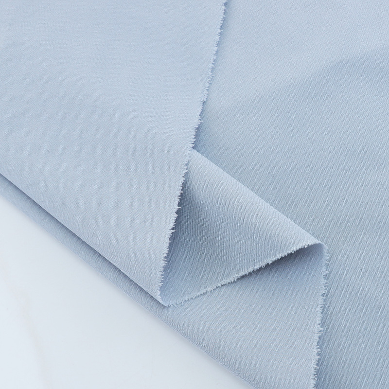 Fábrica en stock algodón de seda fresco liso T400 imitación algodón antiarrugas a prueba de viento tela Otoño e Invierno casual abrigo rompevientos tela