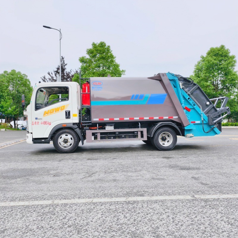Howo pure electric rear-mounted compressed garbage truck with independent sewage collection for municipal solid waste compaction and removal