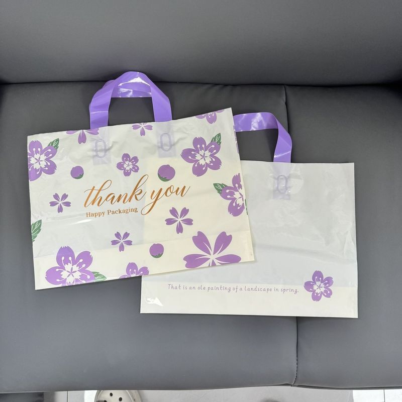 好看的花朵塑料女装衣物服装店用手提袋子包装购物礼品节日礼品袋|undefined