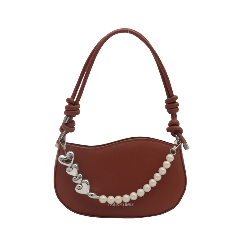 Tendencia de este año 2024 nueva tendencia de perla de viaje de hombro simple moda europea y americana bolso de mano para mujeres