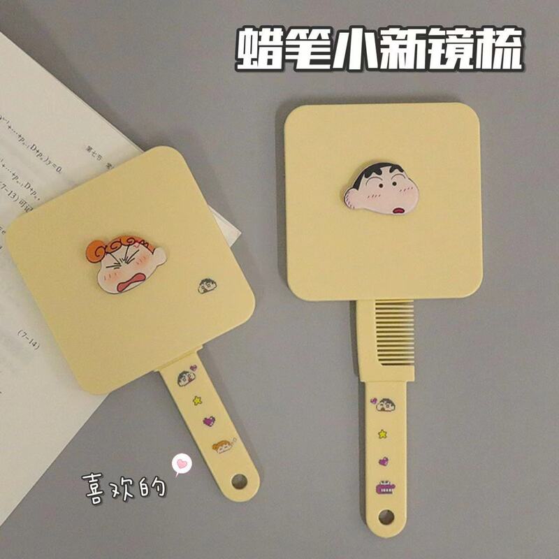 新商品のクレヨンの小さい新しいハンドルの鏡は櫛を持って携帯して化粧の鏡の少女の心の鏡を持って一体の小さい鏡の女性を櫛にします。|undefined