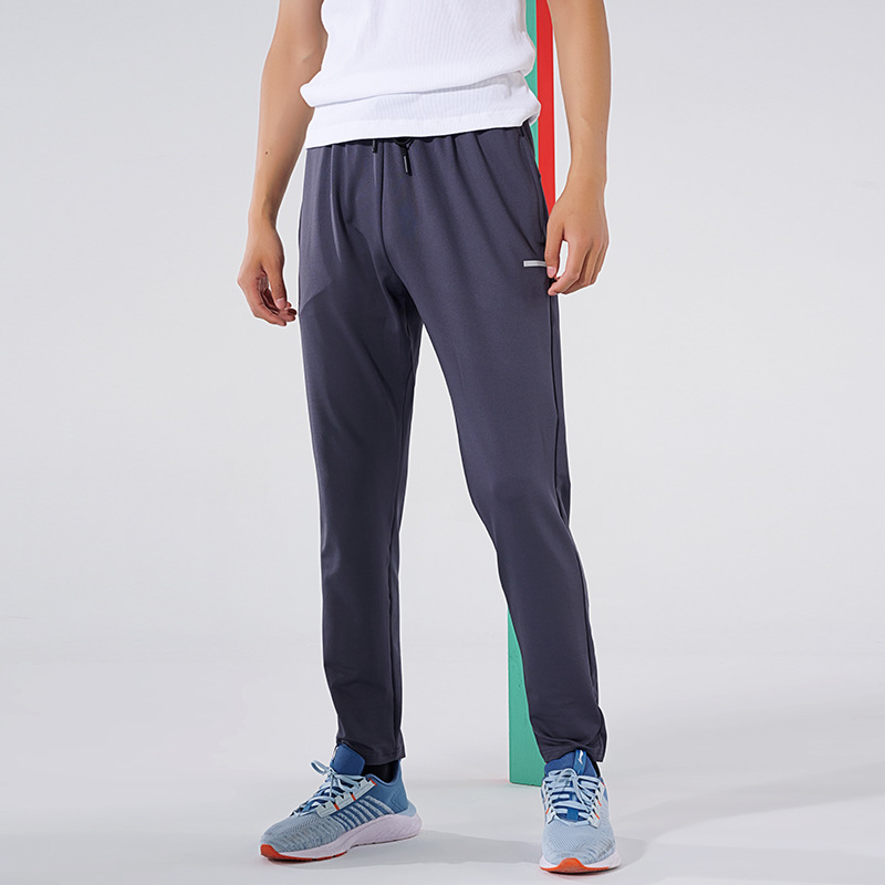 Primavera y otoño de los hombres al aire libre corriendo Pantalones deportivos de secado rápido transpirable flojo más tamaño casual estiramiento pantalones en stock impreso NK